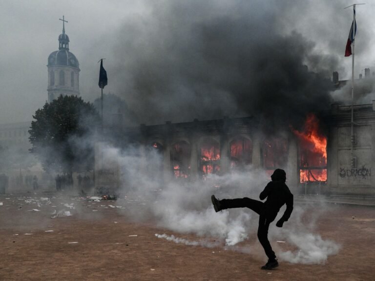 Protesters clash with police during nationwide demonstrations in France