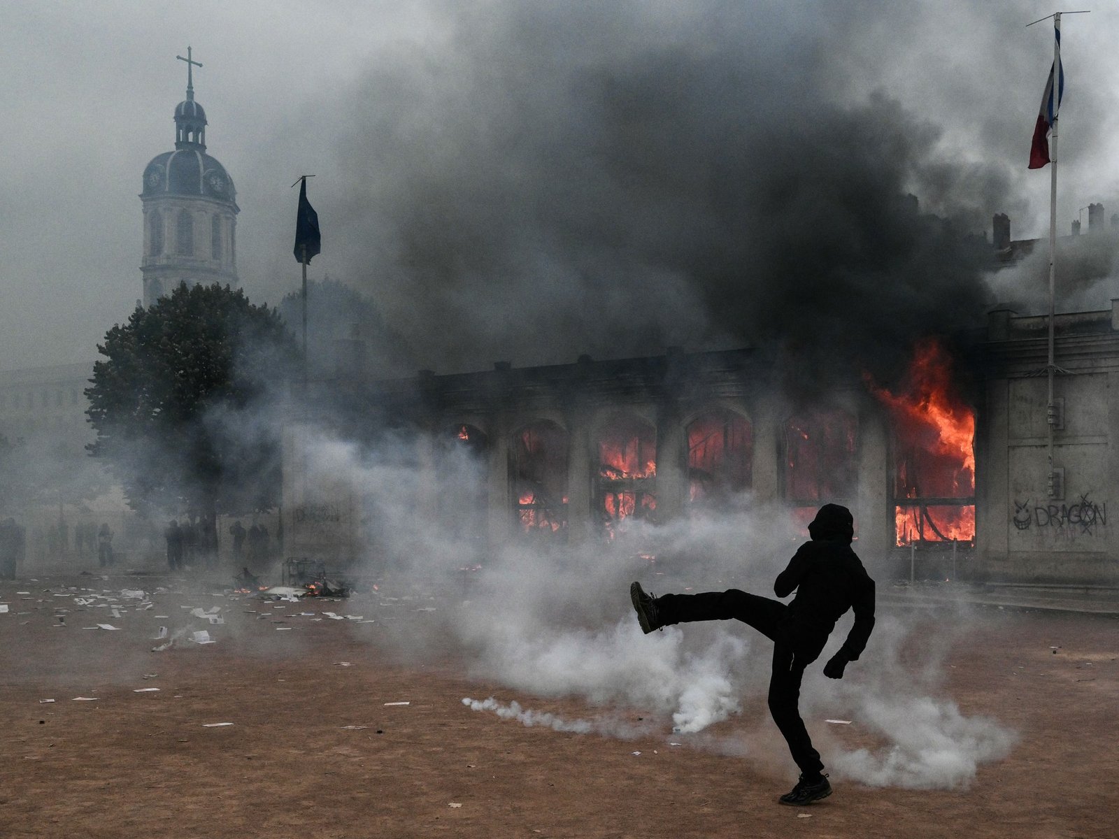 Protesters clash with police during nationwide demonstrations in France