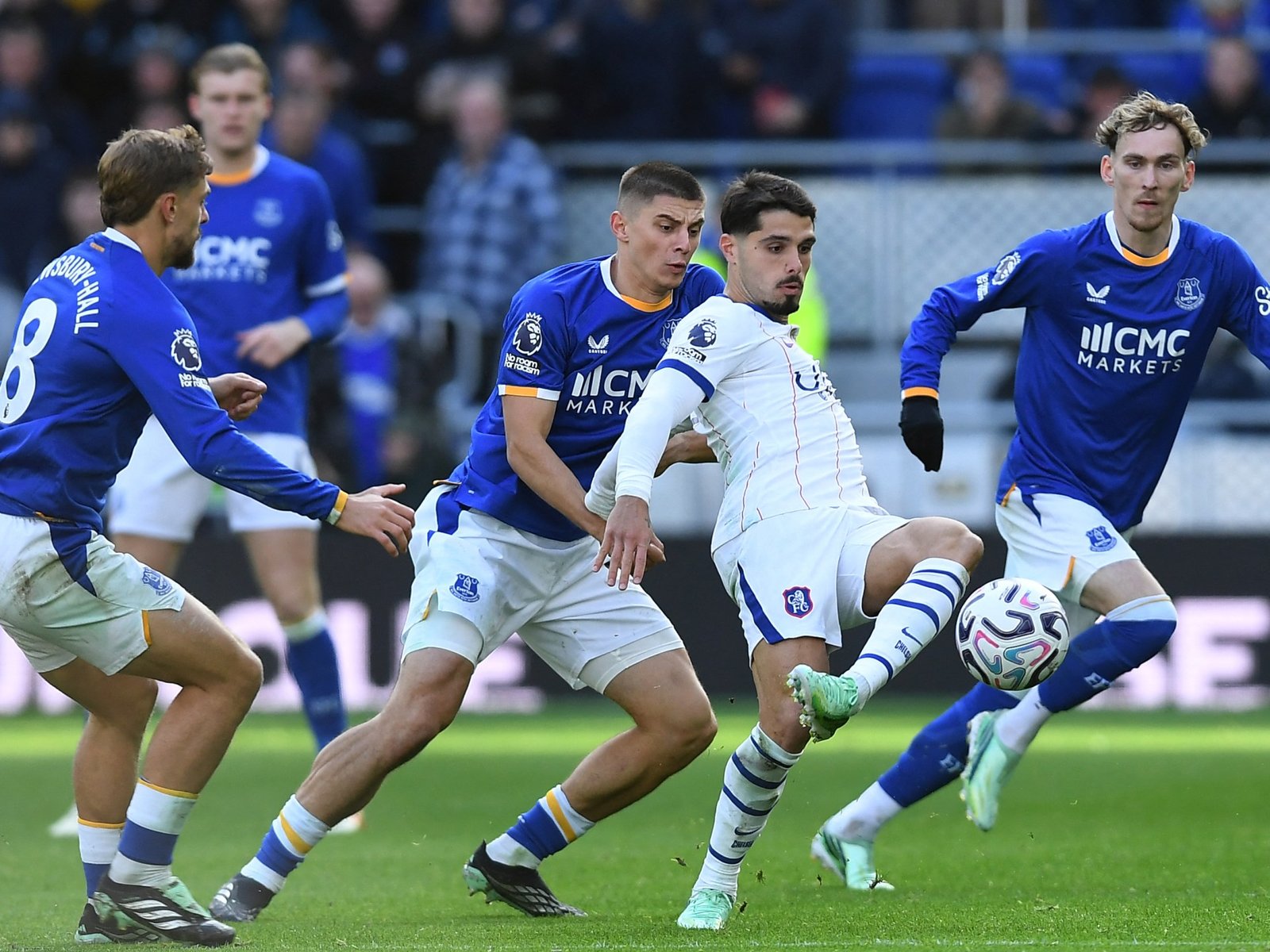 Neto’s brace fires Chelsea past Everton but Martinez head injury mars win