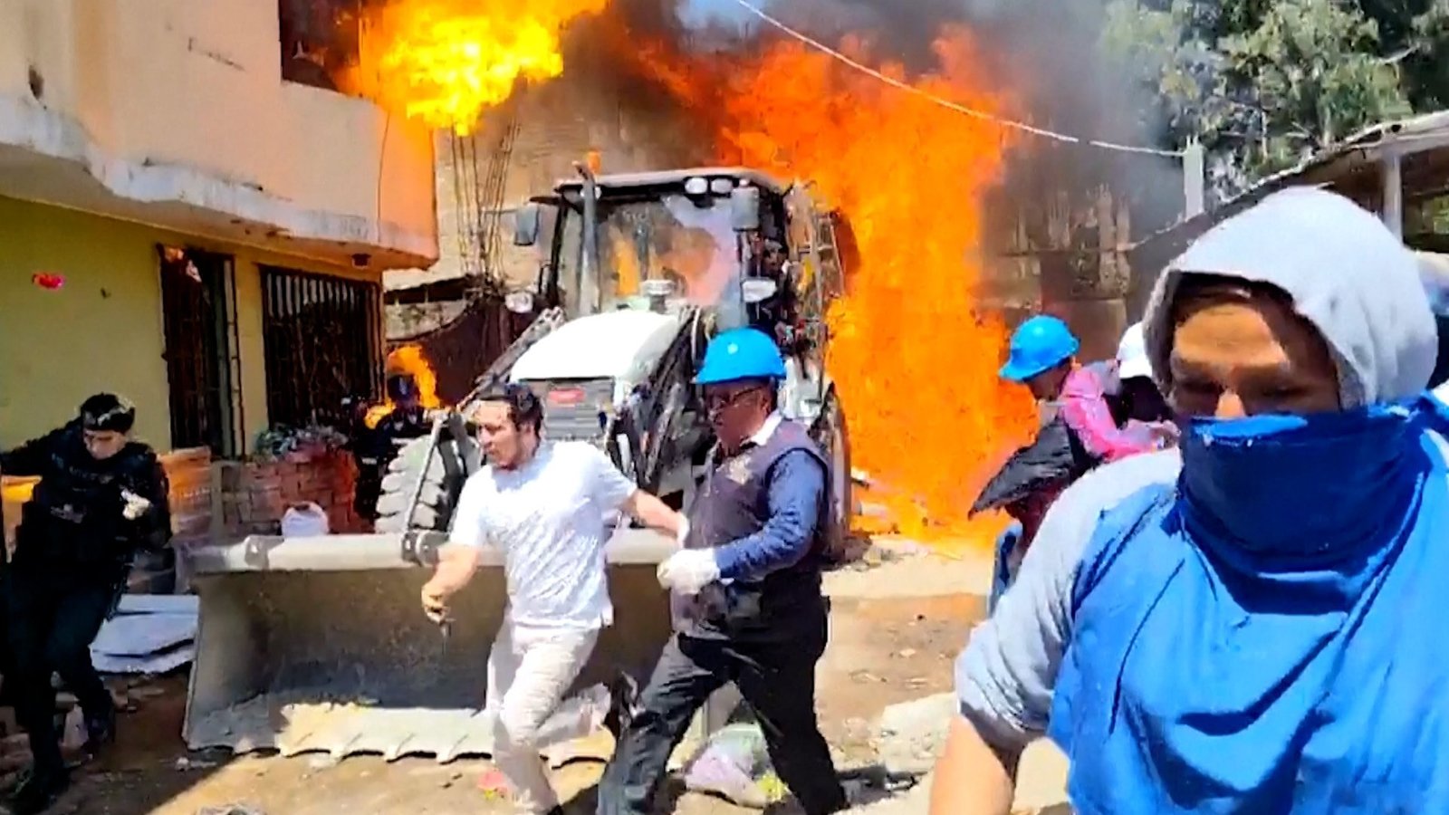 Residents douse workers with flaming gasoline during eviction in Peru