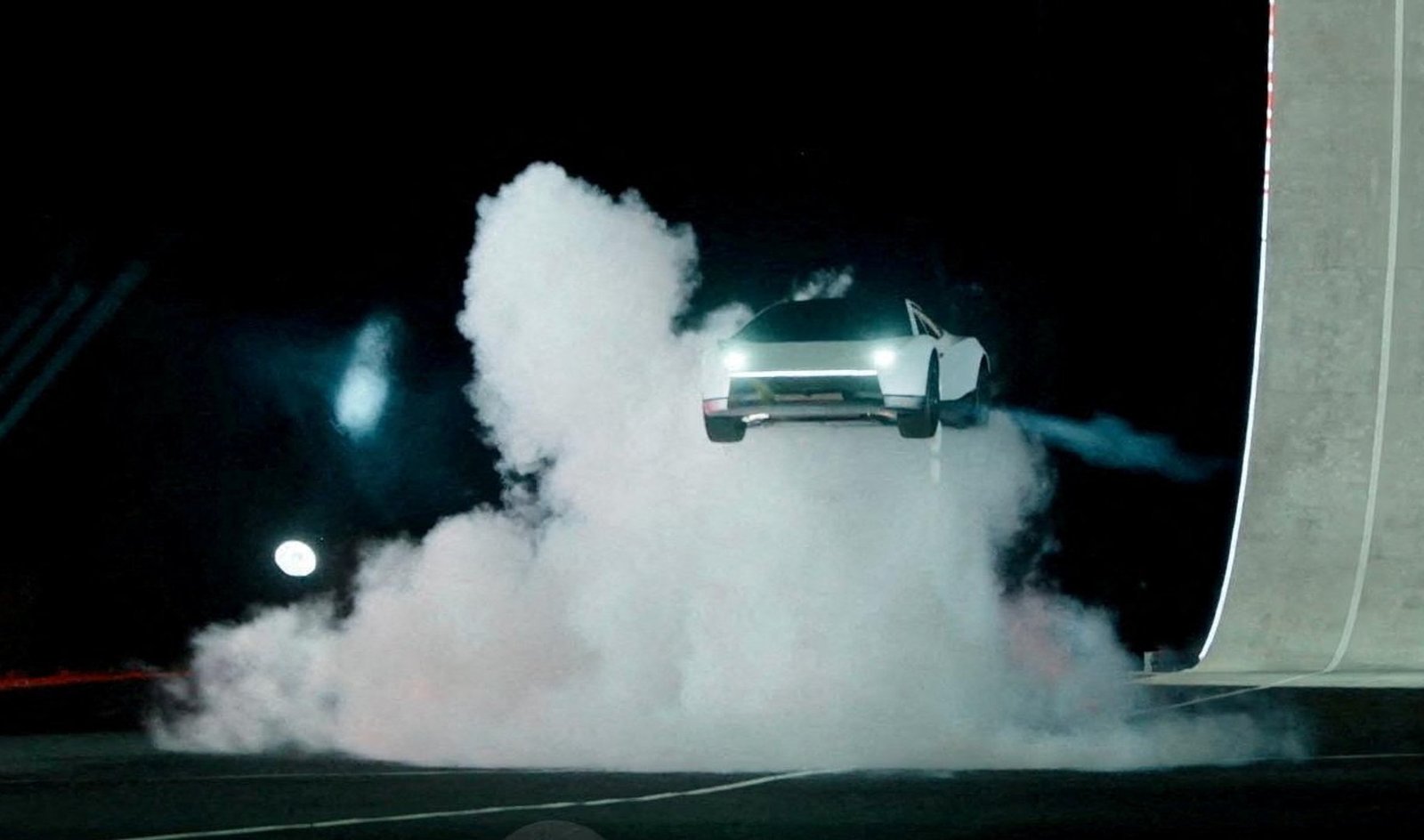 Tesla unveils car that can drive upside down and jump through the air